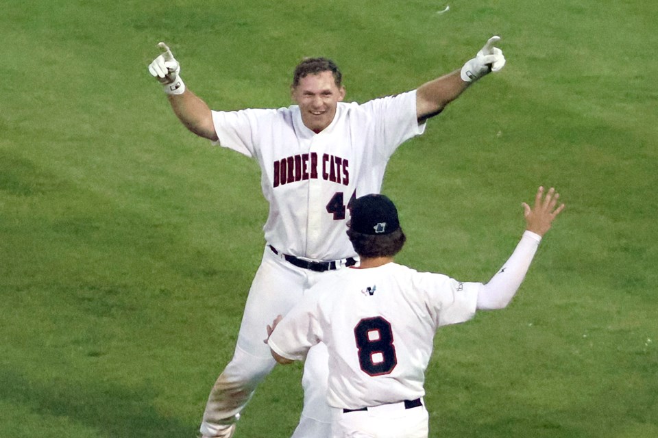 Thunder Bay's Jacob Steinberg and Dylan Snead celebrate the Border Cats 5-4 walk-off win over the LaCrosse Loggers on Tuesday, Aug. 5, 2025. (Leith Dunick, tbnewswatch.com)