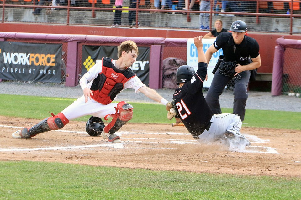 Thunder Bay catcher Duncan Key tags out Mankato's Anthony Avalos at the plate trying to score from second on a single, on Friday, June 27, 2025. (Leith Dunick, tbnewswatch.com)