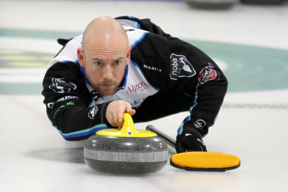 Team Jacobs third Ryan Fry throws a stone during an 8-2 win on Friday, Feb. 10, 2017 at Fort William Curling Club over Thunder Bay's Dylan Johnston rink (Leith Dunick, tbnewswatch.com). 