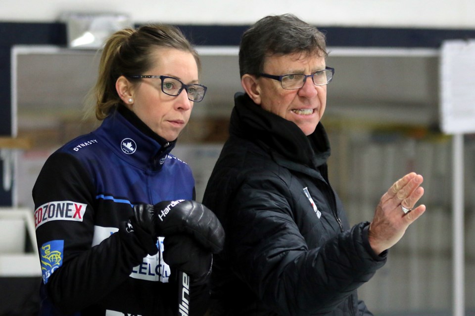 Skip Krista McCarville discusses strategy with coach Rick Lang on Sunday, Nov. 4, 2018 at Fort William Curling Club. (Leith Dunick)