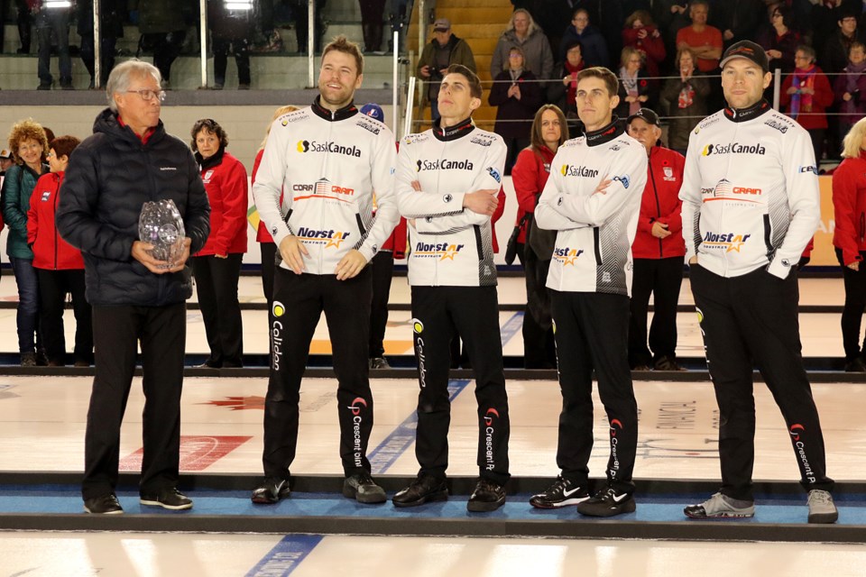 Al Hackner (left) presents Team Muyres with the trophy for winning the Tier 2 men's title at the Pinty's Grand Slam of Curling Tour Challenge on Sunday, Nov. 11, 2018 at the Thunder Bay Tournament Centre. (Leith Dunick, tbnewswatch.com)