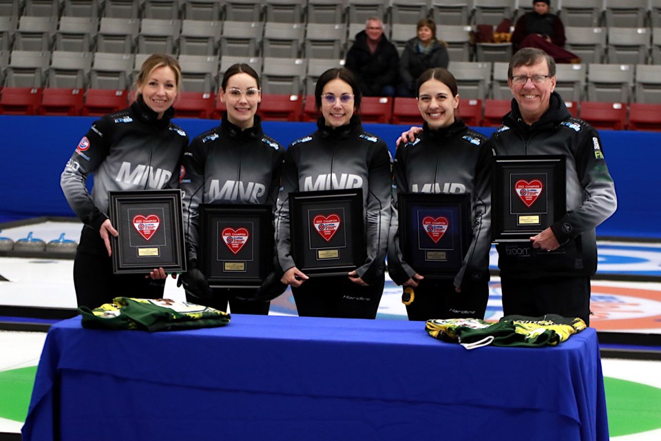 Team McCarville (from left): Skip Krista McCarville, third Kendra Lilly, second Ashley Sippala, lead Sarah Potts and coach Rick Lang, after winning the 2023 Northern Ontario women's curling championship at the Kenora Recreation Centre. (Leith Dunick, tbnewswatch.com)