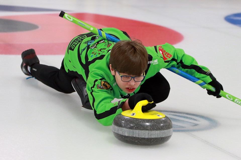 Josh Hari practices on Wednesday, Jan. 4, 2023 at Fort William Curling Club, ahead of the 2023 NOCA U18 provincial championship in North Bay, Ont. (Leith Dunick, tbnewsawtch.com)