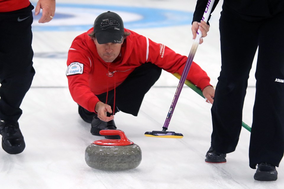 Gary Weiss releases a shot on Wednesday, Oct. 13, 2021 at the Port Arthur Curling Club. (Leith Dunick, tbnewswatch.com)