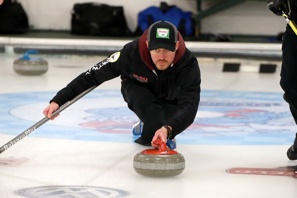 Brian Adams Jr. releases a shot on Wednesday, Jan. 11, 2023 in Tbaytel Major League of Curling Draw 13 play at the Port Arthur Curling Club. (Leith Dunick, tbnewswatch.com)
