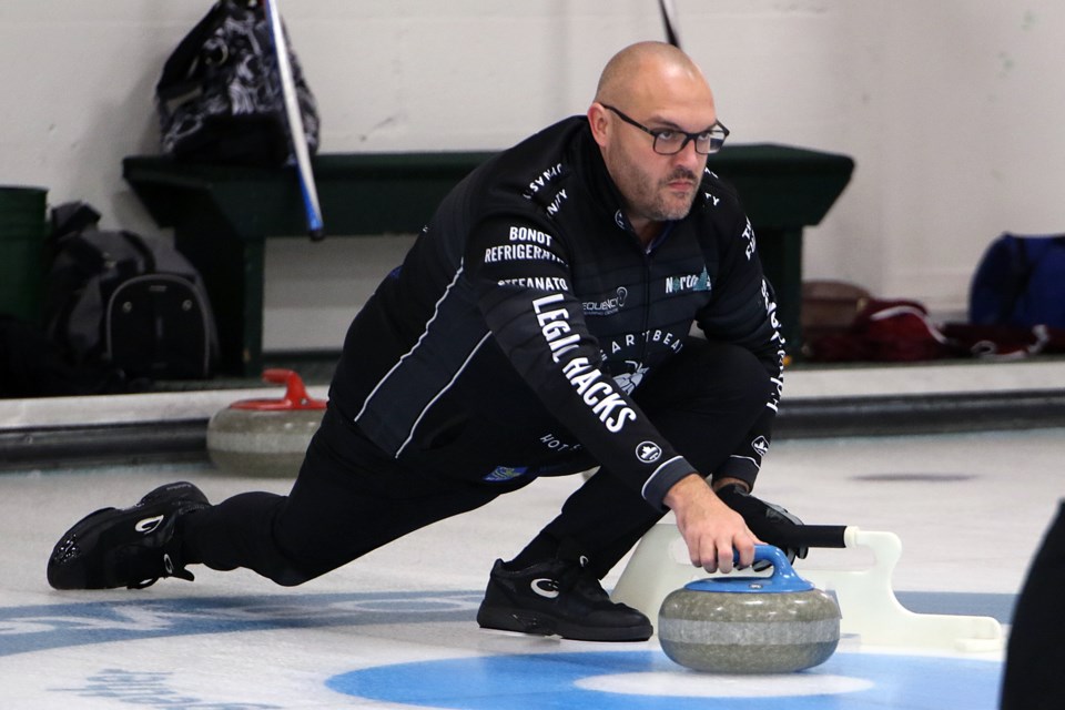 Trevor Bonot takes a shot on Wednesday, Oct. 26, 2022 at the Port Arthur Curling Club. (Leith Dunick, tbnewswatch.com)