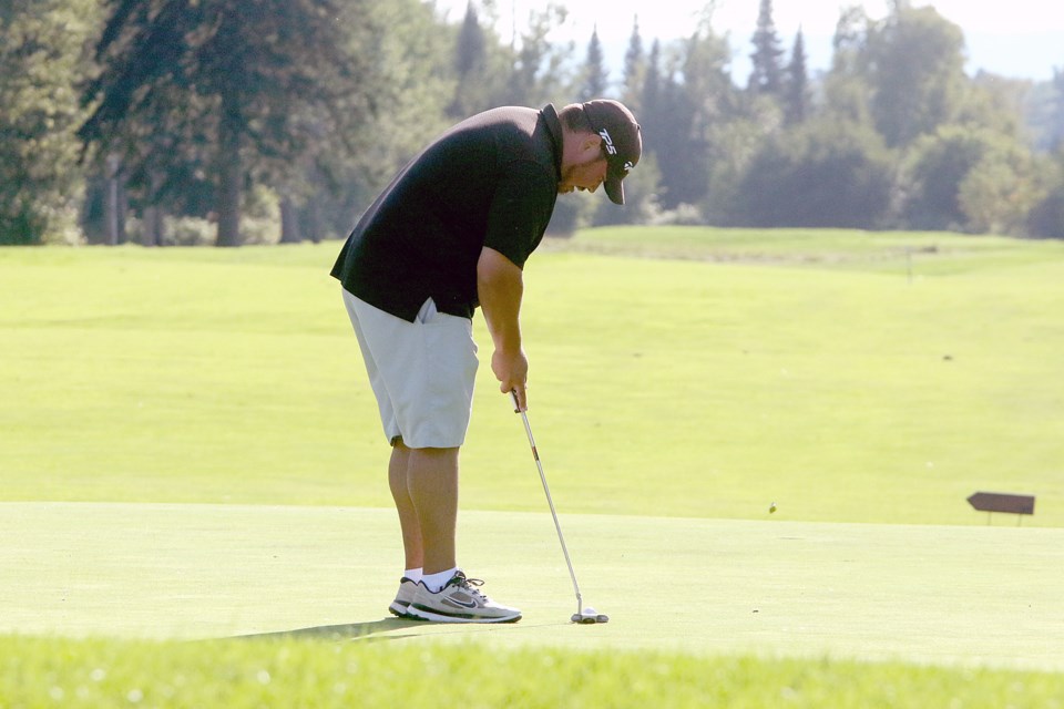 Champion Colin Sobey lines up his first putt on 18 on Monday, Sept. 3, 2018 at the Teleco District Open at Whitewater Golf Club. (Leith Dunick, tbnewswatch.com)