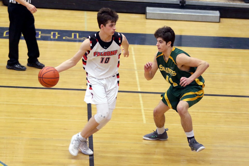 St. Igntius forward Ethan Willmore (left) looks for space against St. Patrick's Noah Jameus on Thursday, Feb. 20, 2020 at the Thunderdome in the senior boys' baskerball final. (Leith Dunick, tbnewswatch.com)