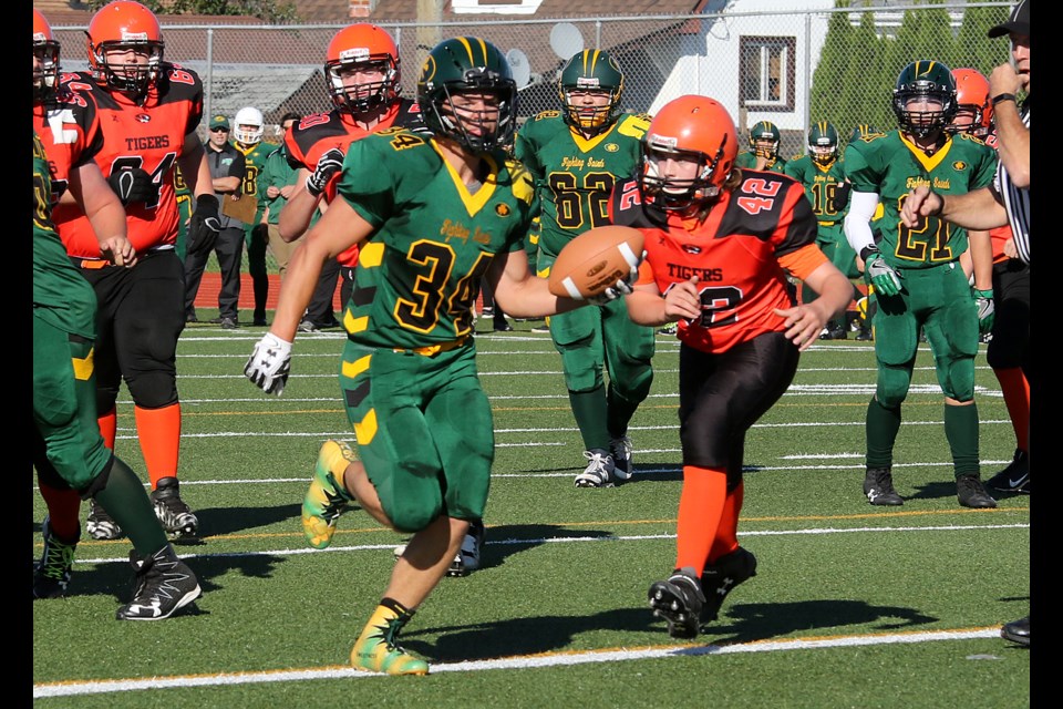 Westgate's Duncan Neil (right) can't catch St. Patrick's Payton Littleford before he crosses the goaline on Thursday, Sept. 21, 2017 at Fort William Stadium (Leith Dunick, tbnewswatch.com)