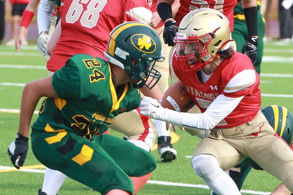 Hammarskjold's Kain Cristofaro (right) scored twice for the Vikings on Thursday, Sept. 28. Here he takes on St. Patrick defender Connor Shewchuk in a one-on-one battle. (Leith Dunick, tbnewswatch.com)