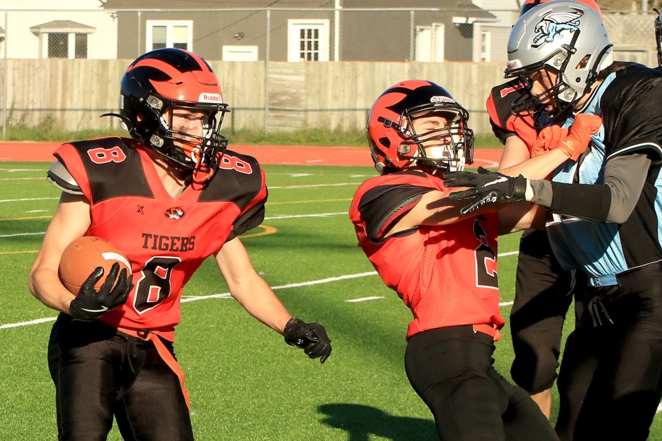 Clark Matson (left) carries the ball for Westgate on Thursday, Sept. 26, 2024, in a 45-12 triumph over the Superior Collegiate Gryphons. (Leith Dunick, tbnewswatch.com)