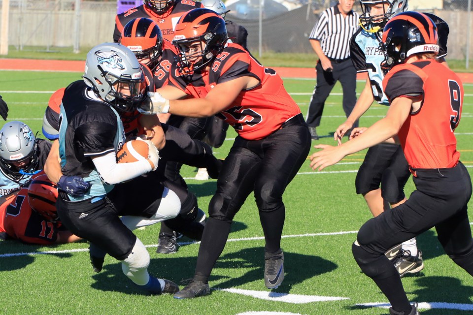 Superior's Orran Nichols is tackled by Westgate's Griffin Alderdice (55) and Miles Kozar, on Thursday, Sept. 26, 2024. (Leith Dunick, tbnewswatch.com)