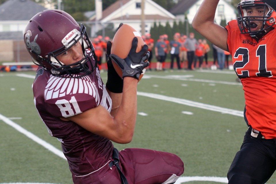 Churchill's James Basalyga gets past Westgate's Cameron Mackey for a reception on Saturday, Sept. 17, 2016 at Fort William Stadium in senior boys high school football action (Leith Dunick, tbnewswatch.com).
