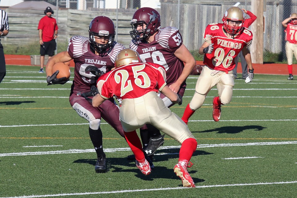 Churchill's James Basalyga (81) runs with the ball as Hammarskjold's Travis Halls attempts the tackle on Friday, Sept. 23, 2016 at Fort William Stadium (Leith Dunick, tbnewswatch.com). 