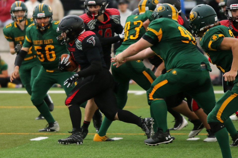 Tyler Robertson at the start of a 109-yard touchdown run in the second quarter on Friday, Oct. 1, 2021 against a sea of St. Patrick Saints defenders. (Leith Dunick, tbnewswatch.com)