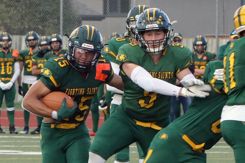 Manerplaw Winning runs behind the blocking of St. Patrick teammate Kiran MacKenzie on Friday, Sept. 30, 2022 in a 31-25 win over Westgate at Fort William Stadium. (Leith Dunick, tbnewswatch.com)