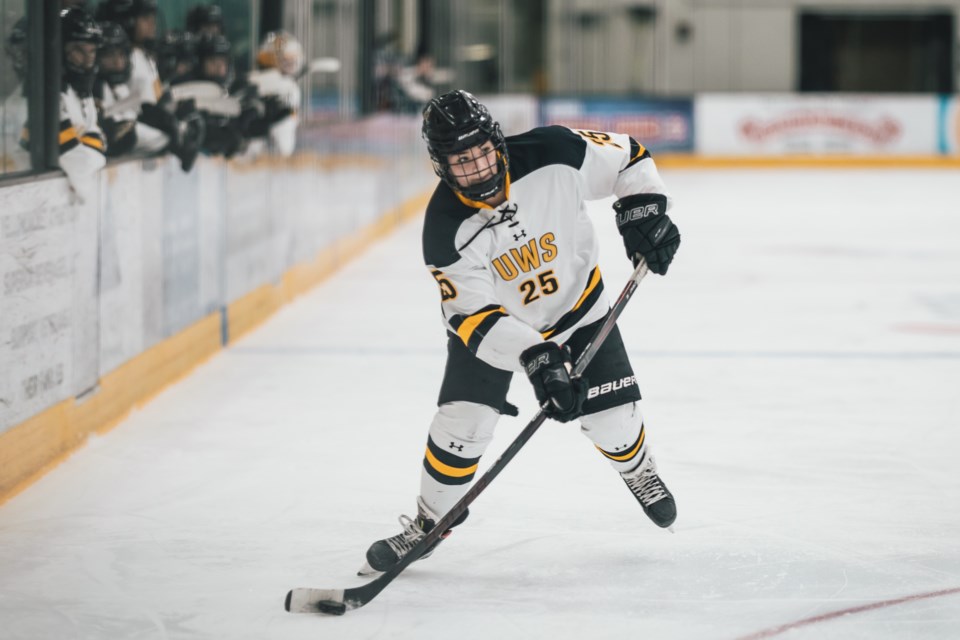 Atikokan's Darbie Mattson plays the puck for the University of Wisconsin-Superior Yellowjackets