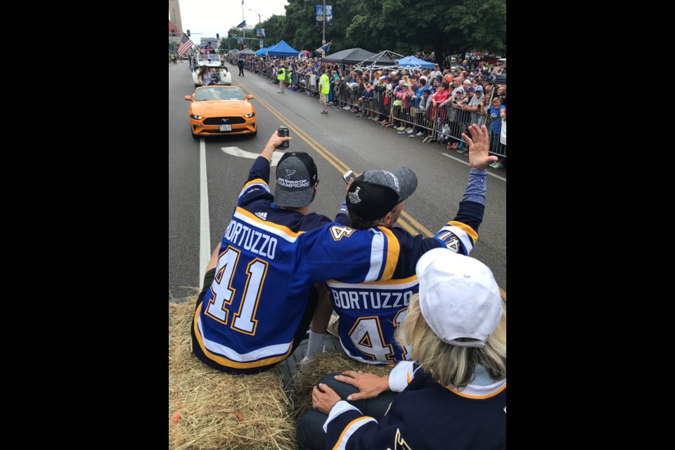 Robert and Oscar Bortuzzo celebrating in front of fans at the championship parade in St. Louis, Miss. on June 16. (Supplied.)