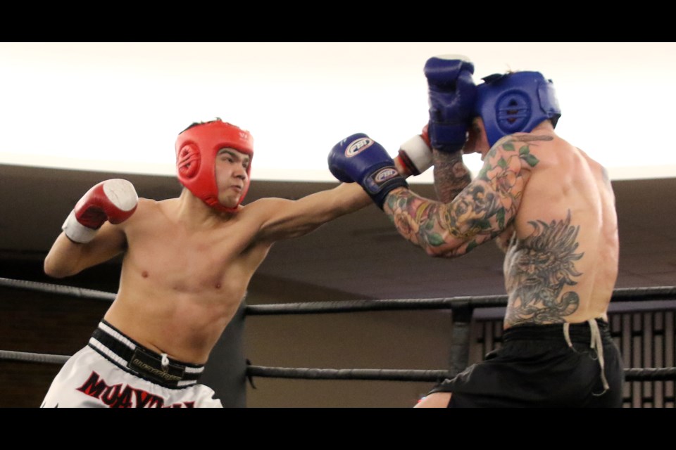 Kickboxer Mitchell Spence (left) lands a blow against opponent Kevin McCarthy on Saturday, April 22, 2017 at the Da Vinci Centre (Leith Dunick, tbnewswatch.com). 