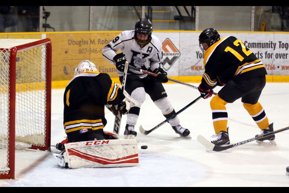 Kings forward Michael Stubbs (centre) attempts to complete the wraparound on Fort Frances goaltende Isaac Fagnilli and defenceman Braden Bodnarchuk on Wednesday, March 29, 2017 at the All Ontario Bantam AAA Championship at Fort WIlliam Gardens (Leith Dunick, tbnewswatch.com). 