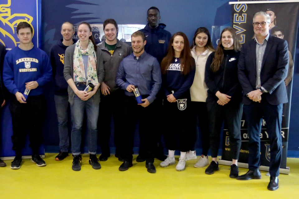 Lakehead's athletes of the month for January, announced on Tuesday, Feb. 4, 2020, included wrestler John Campbell, skier Levi Warkentin, track and field's Amy Stieh, hockey's Josh Labramboise, track and field's Niko Dowhos, basketball's Lock Lam and Sofia Lluch, volleyball's Rebekah Hara and skiing's Shaelynn Loewen. Also pictured is LU athletic director Tom Warden. (Leith Dunick, tbnewswatch.com)