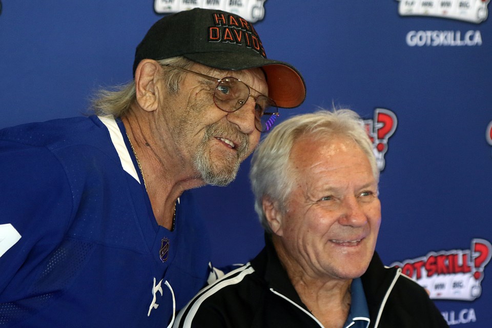 Former Toronto Maple Leafs star Darryl Sittler (right) signed autographs and posed for pictures at Newfie's Pub in Thunder Bay on Wednesday, June 29, 2022. (Leith Dunick, tbnewswatch.com)