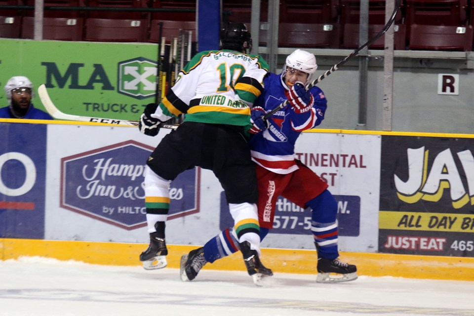 Thunder Bay's Aaron Balcombe (left) collides with Minnesota's Sheamus Stoyle during first period SIJHL play at the Fort William Gardens on Wednesday, Sept. 28, 2016 (Leith Dunick, tbnewswatch.com). 