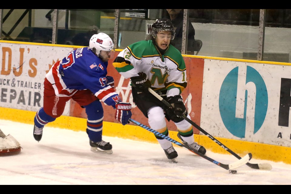 Minnesota's Sheamus Stoyle (left) chases down Thunder Bay's Brendan Gillis on Saturday, Dec. 3, 2016 at Fort William Gardens (Leith Dunick, tbnewswatch.com). 