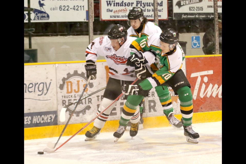 Fort Frances defenceman Travis Glomba and Thunder Bay North Stars forward Aaron Balcombe race after the puck behind the Lakers net on Wednesday, Feb. 1, 2017 at Fort William Gardens (Leith Dunick, tbnewswatch.com). 