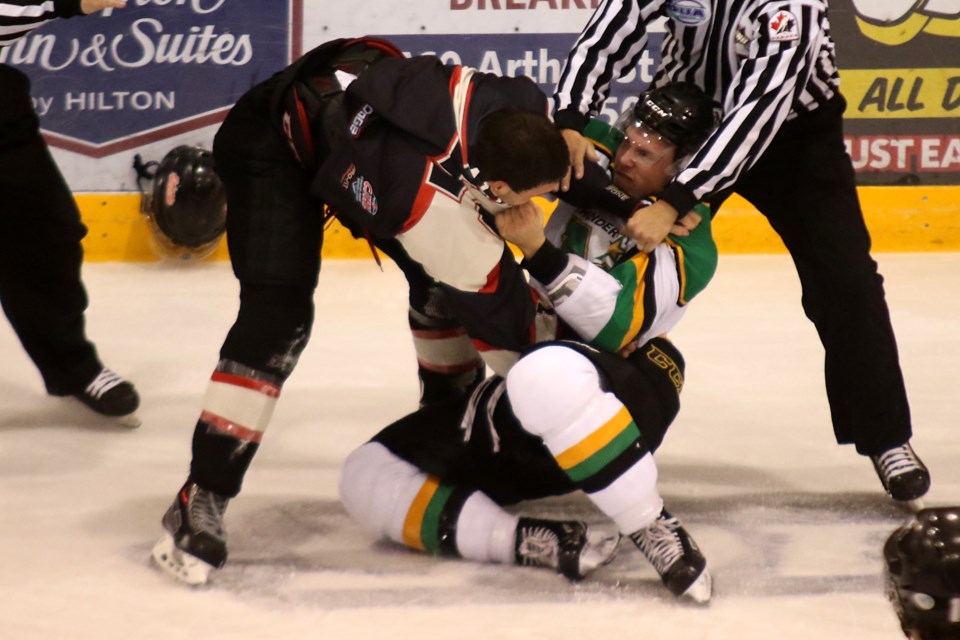 Fort Frances' Dominick Allan and Thunder Bay's Charlie Corness duke it out in the second period on Friday, Oct. 28, 2016 at Fort William Gardens (Leith Dunick, tbnewswatch.com). 