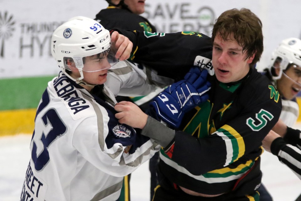 Dryden's Jacob Siebenga (left) and Thunder Bay's Cole Turbide tangle during an SIJHL contest at Fort William Gardens on Saturdy, Feb. 9, 2019. (Leith Dunick, tbnewswatch.com)