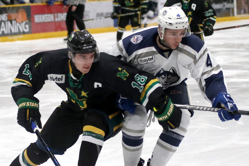 North Stars captain Ryan Mignault (left) scored a pair of goals on Tuesday, March 5, 2019 against Kyle Sargent and the Dryden Ice Dogs at Fort William Gardens (Leith Dunick, tbnewswatch.com)