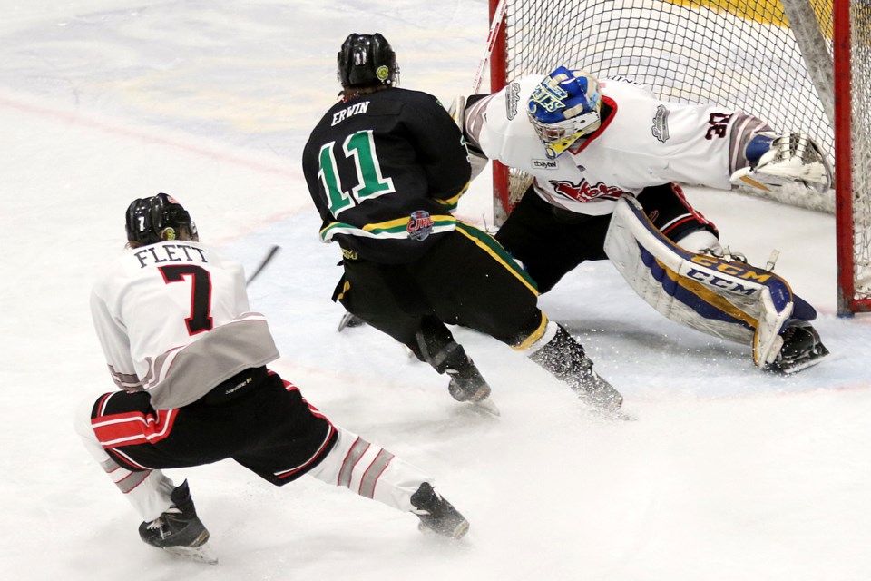 Thunder Bay's Ben Erwin makes a move on Fort Frances goalie Jacob Gnidziejko with Lakers defender Mackenzie Flett hot in pursuit on Tuesday, Feb. 19, 2019 at Fort William Gardens. (Leith Dunick, tbnewswatch.com)