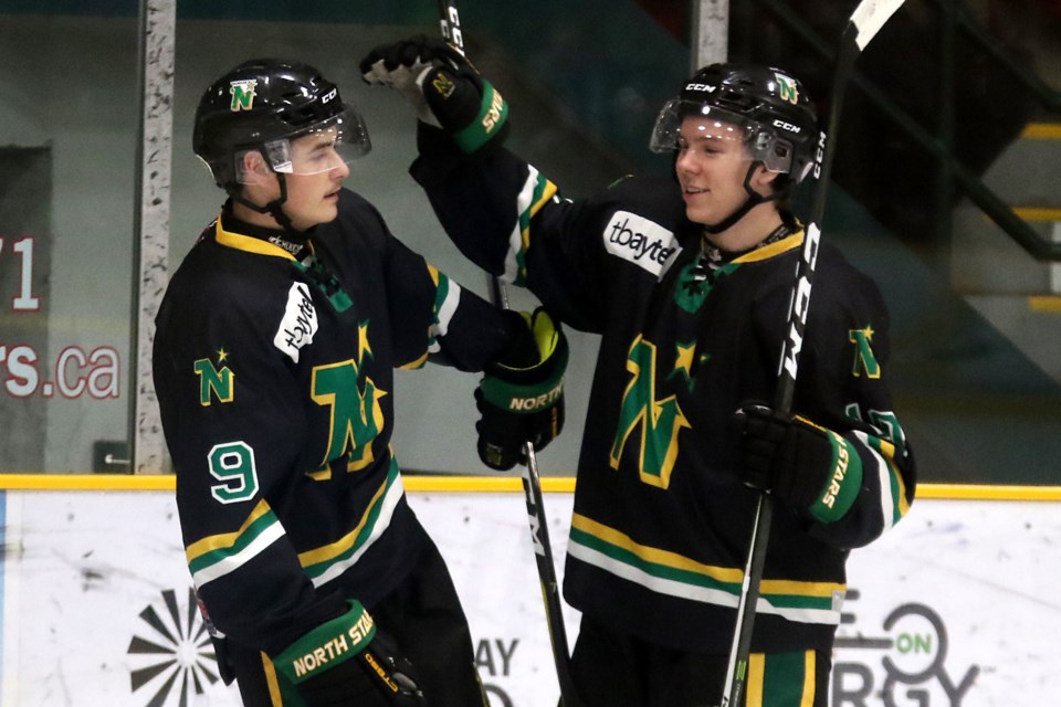 Thunder Bay's Jacob Brown (right) congratulates teammate Joel Willan after Willan scored his first of two goals on Saturday, Jan. 12, 2019 against the Thief River Falls Norskies at Fort William Gardens. (Leith Dunick, tbnewswatch.com)