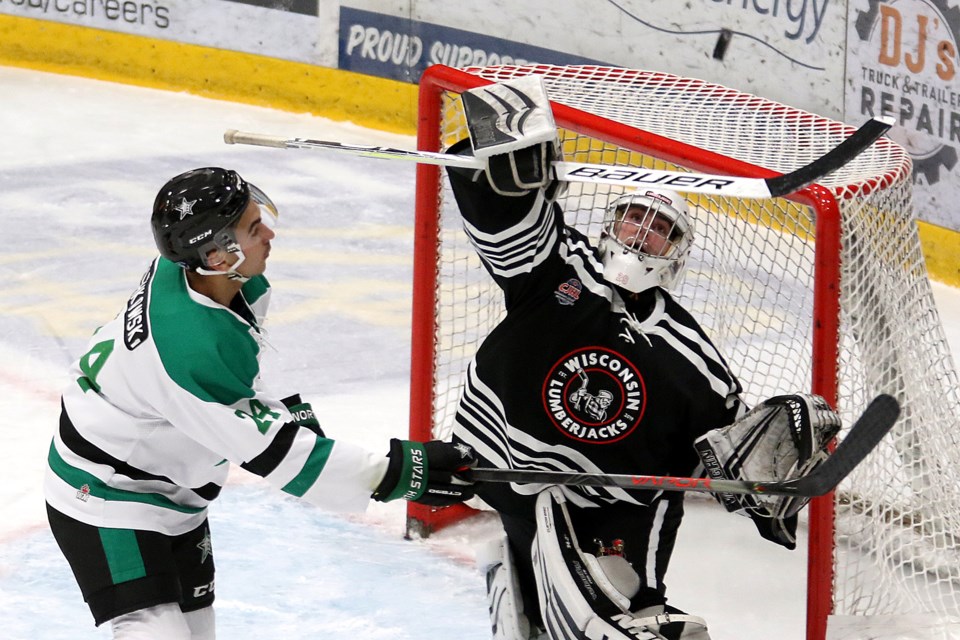 Wisconsin goaltender Nathan Mueller tries to bat the puck out of the way of Thunder Bay forward Cody Bruchkowski on Wednesday, Nov. 6, 2019 at Fort William Gardens. (Leith Dunick, tbnewswath.com)