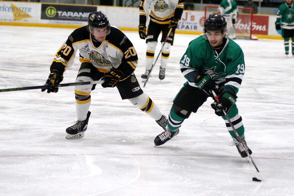 Red Lake's Carson Lux (left) chases down Thunder Bay's Michael Vecchio in first-period play on Friday, Jan. 10, 2019 at Fort WIlliam Gardens. (Leith Dunick, tbnewswatch.com)