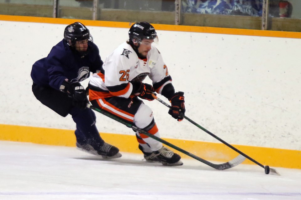 Kam River's Zach Fortin (right) pulls away from a Lakehead Junior Hockey League All-Star defender on Saturday, Sept. 11, 2021 at the NorWest Arena. (Leith Dunick, tbnewswatch.com)