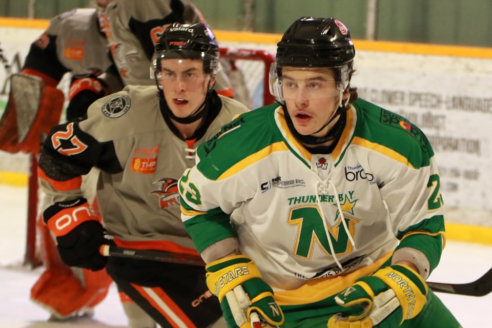 Kam River's Josh Pufahl (left) and Thunder Bay's E.J. Paddington seek out the puck on Wednesday, Feb. 8, 2023 at the Norwest Arena. (Leith Dunick, tbnewswatch.com)