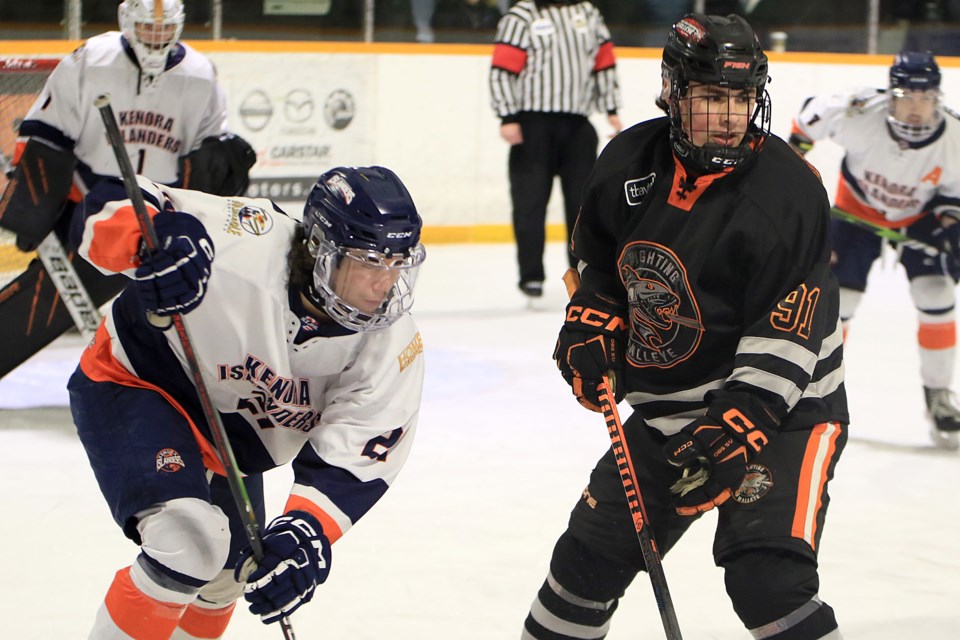 Kam River's Kaden Goodwin (right) faces off against Kenora's Jayden McPherson-Nepinak on Friday, March 22, 2024 in Game 1 of their SIJHL opening round playoff series at the Norwest Arena. (Leith Dunick, tbnewswatch.com)