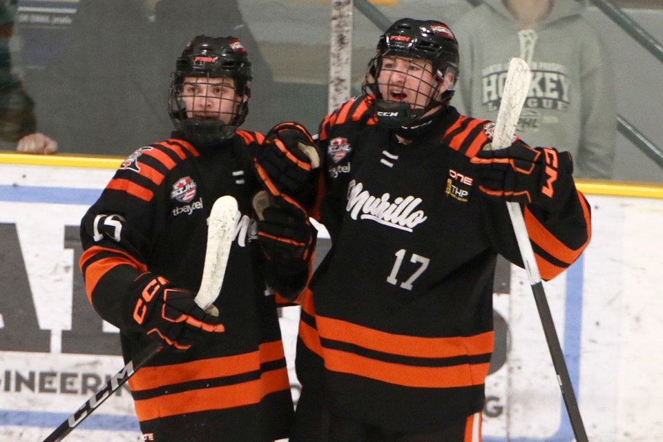 Jett Mintenko (right) and teammate Carter Nailen celebrating a hat trick on Wednesday, Nov. 22, 2023 against the Thunder Bay North Stars at Fort William Gardens. (Leith Dunick, tbnewswatch.com)