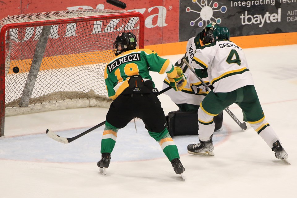 Thunder Bay's Beau Helmeczi watches the game-winning goal sail into the Sioux Lookout net, past defenceman Josh Greene and goaltender Jack Osmond, on Tuesday, April 9, 2024 at Fort William Gardens. (Leith Dunick, tbnewswatch.com)