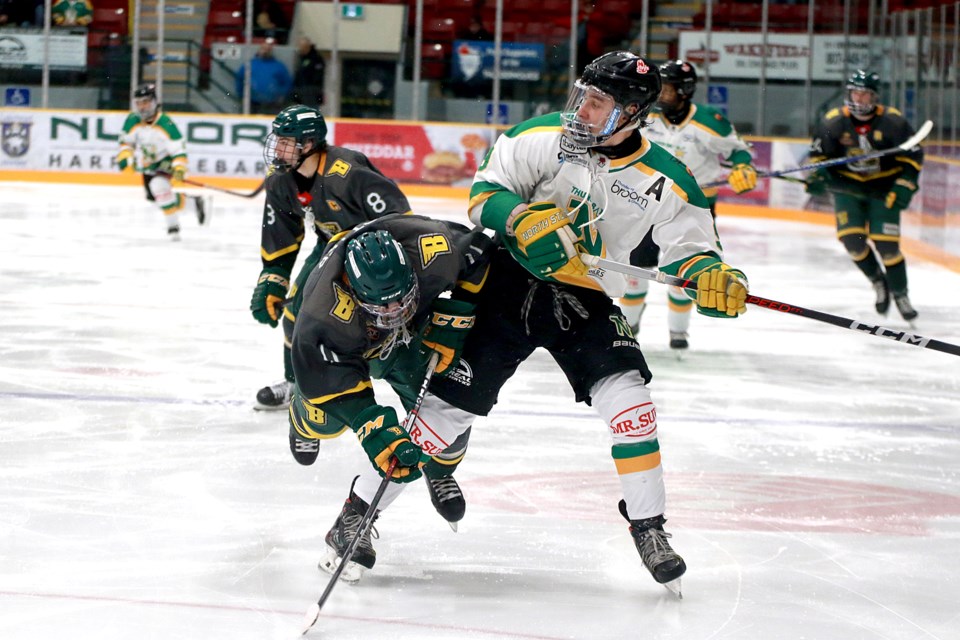 Thunder Bay's E.J. Paddington checks Sioux Lookout's Owen Cotter on Saturday, Oct. 28, 2023 at Fort William Gardens. (Leith Dunick, tbnewswatch.com)