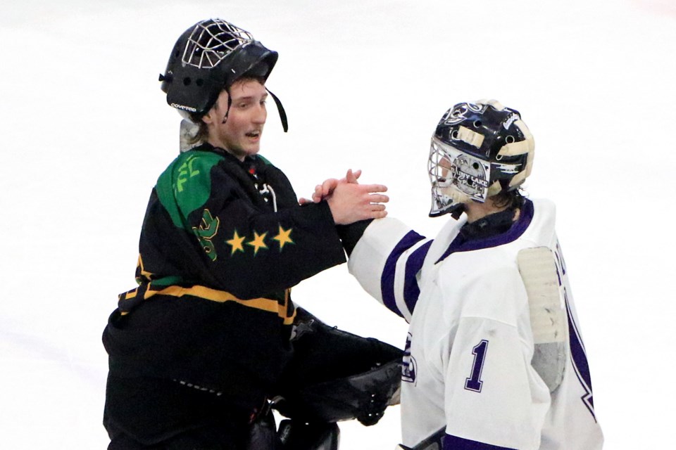 Fort Frances Lakers goaltender Gunner Paradis (right) congratulates his Thunder Bay North Stars counterpart, Keenan Marks, after the Stars blanked the Lakers 4-0 in Game 7 of their SIJHL quarterfinal on Tuesday, April 1, 2025. (Leith Dunick, tbnewswswatch.com)