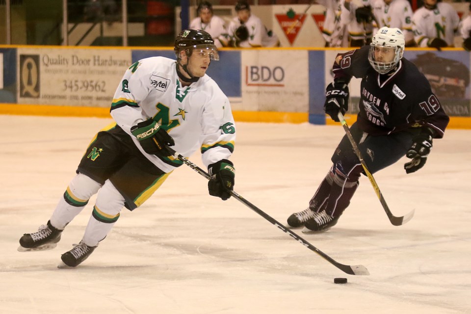 Thunder Bay forward Ryan Mignault attempts to get around Dryden forward Conner Mowatt on Tuesday, April 17, 2018 at Fort William Gardens in Game 3 of the BIll Salonen Cup final. (Leith Dunick, tbnewswatch.com)