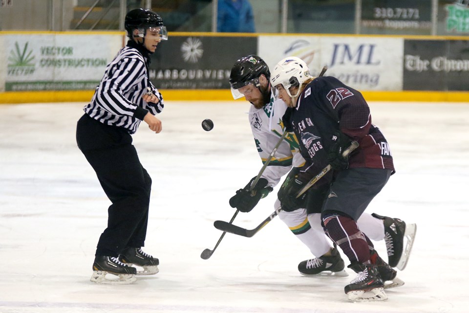 Dryden's Trey Palermo (right) and Thunder Bay's Carson Smith battle after taking a first-period draw on Wednesday, April 18, 2018 at Fort William Gardens. (Leith Dunick, tbnewswatch.com)