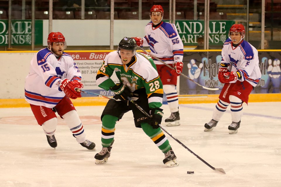 Minnesota's Josh Houdek (left) chase down Thunder Bay's Brad Thrower on Wednesday, Sept. 27, 2017 during the North Stars 2017-18 home opener at Fort William Gardens (Leith Dunick, tbnewswatch.com). 