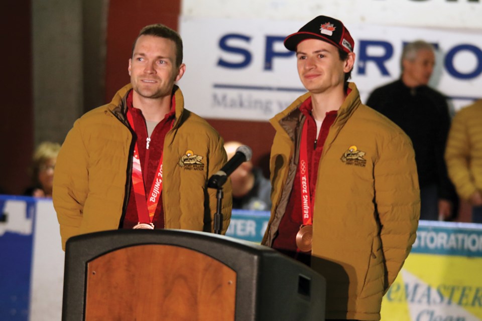 Olympic bronze medalists Mackenzie Boyd-Clowes (left) and Matthew Soukup speak to students on Monday, May 16, 2022 at Fort William First Nation Arena. (Leith Dunick, tbnewswatch.com)
