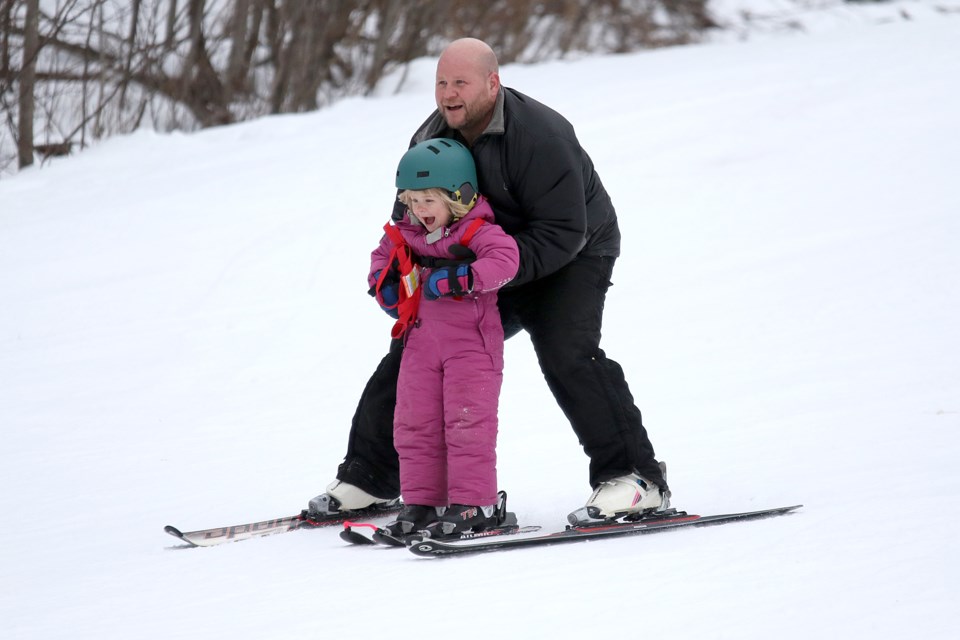 Evelyne Aaltoma; 3; and her father Tom enjoy an afternoon of skiing on Wednesday; Jan. 25; 2017 at Loch Lomond Ski Area (Leith Dunick; tbnewswatch.com).
