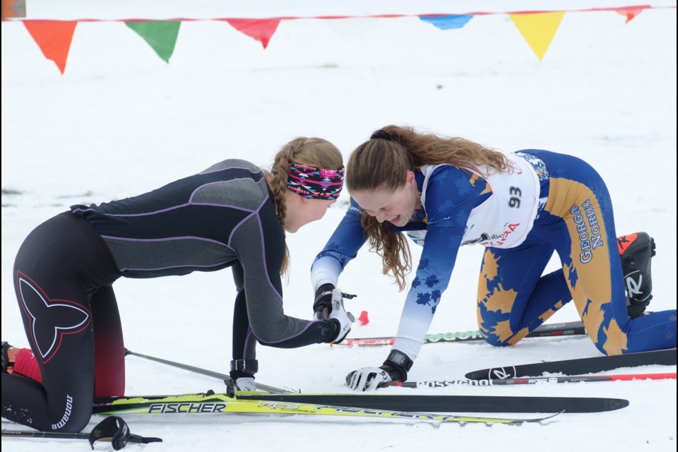 Gold medal winner Hannah Shields (Junior women) at finish line with gold medal winner Shaylyn Loewen (junior girls). (Photos by  Kevin Schlyter and Doug Ranahan)
