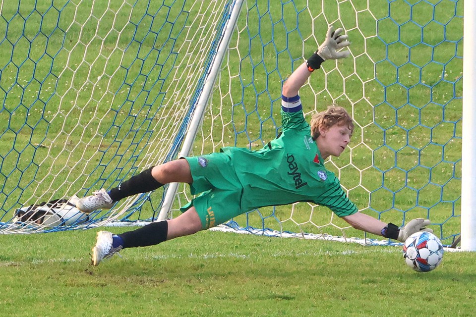 Thunder Bay Chill keeper Odin Bromley makes a big stop on a penalty kill against Winnipeg's 1v1 Futbol Dreams in the finale of the Chill's International Invitational Tournament. (Leith Dunick, tbnewswatch.com)